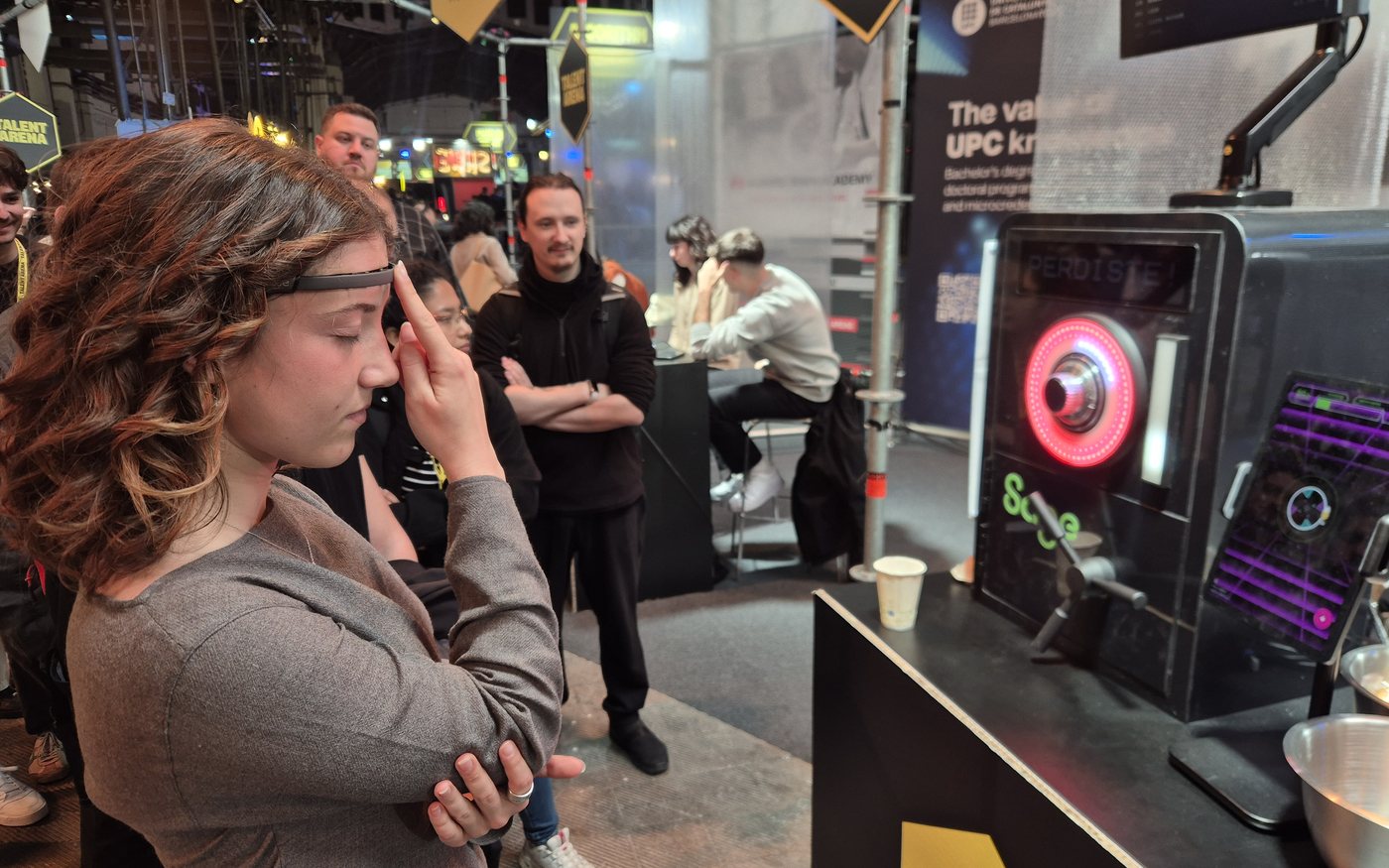A guest wearing an EEG headband concentrating in front of Homer