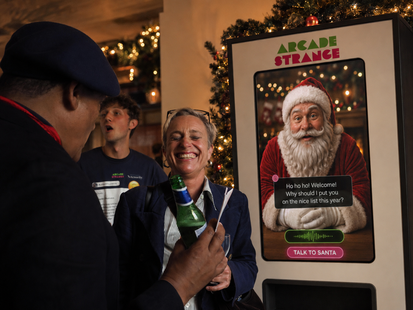 A guest laughing as she talks to Grumpy Santa on the Arcade Strange screen at a Christmas party